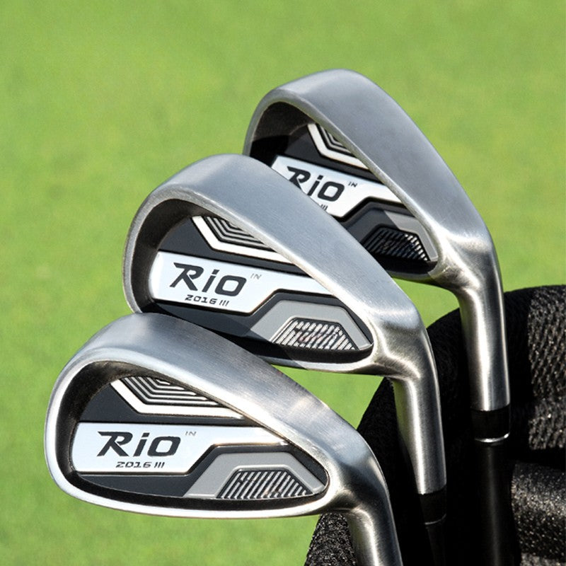 Three Rio 201.6 III golf iron clubs with silver and black metal heads, partially tucked into a black golf bag against a blurred green grass background.