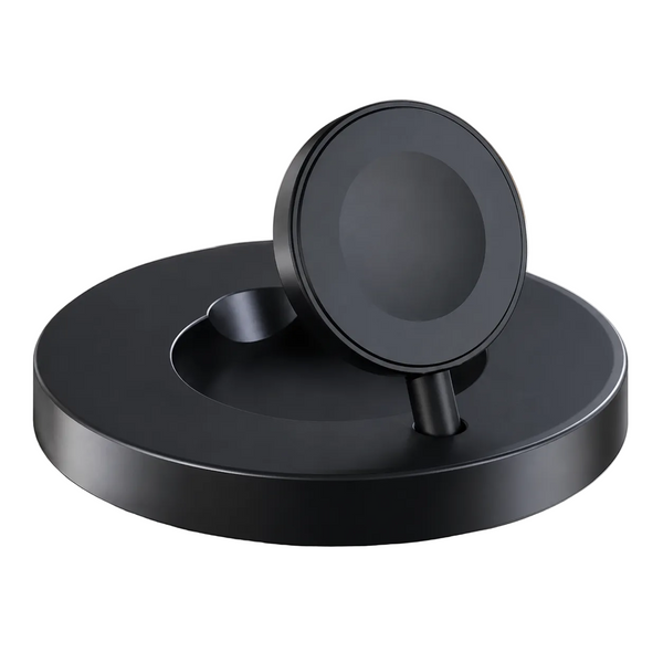 A matte black magnetic wireless charging stand with a circular base and a tilted charging pad, shown on a white marble surface with a blurred indoor background.